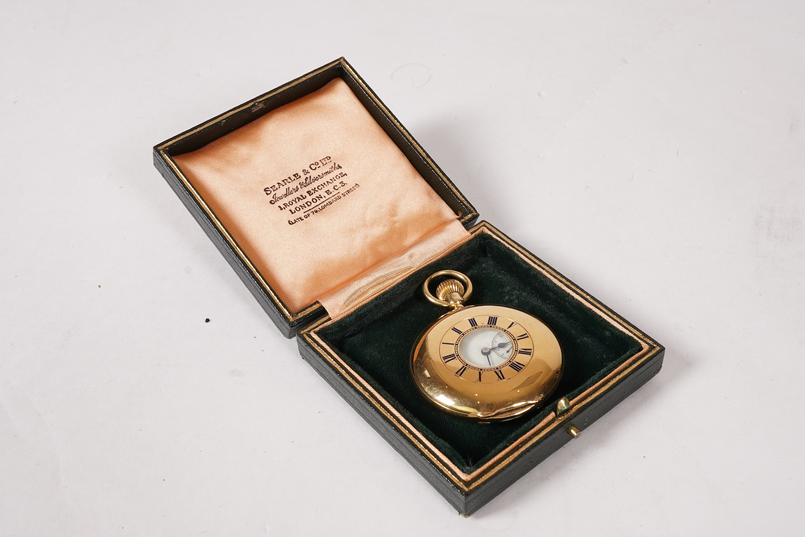 An Edwardian 18ct gold half hunter keyless lever pocket watch, by Searle & Co, Lombard Street, London